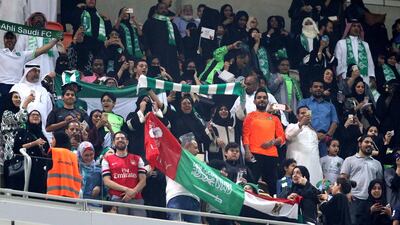 epa06434153 Saudi families cheer at the King Abdullah Sports City known as 'a radiant jewel' to attend the Saudi Football League soccer match Al Ahly and Al-Batin in Jeddah, Saudi Arabia, 12 January 2018. Saudi women for the first time are allowed to enter a sports stadium to watch a soccer match. They will be segregated from the male-only crowd with designated seating in the so-called 'family section'. EPA/STR