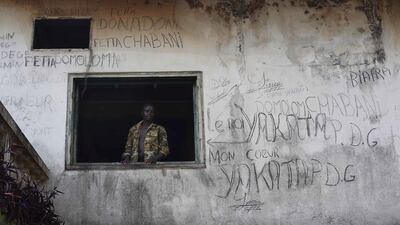 Central African Army Forces cadets stand in Jean Bedel Bocassa’s Berengo palace near Pissa, some 80 kilometres south-west of Bangui, Central African Republic, on January 26, 2014. Up to 500 registered cadets are stationed in the palace-turned-training-camp without officers. They hunt mice and birds for food, use weapons made of wood, and await instructions that do not come. In Mbaiki, down the road, a local commander of the Muslim Seleka blamed Christian anti-Balaka militias for sending the country into chaos and vowed reprisals if the newly appointed interim government would not put an end to Muslim killings in the country. Jerome Delay / AP photo