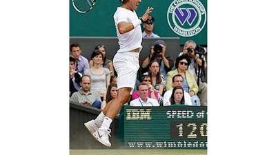 Spain's Rafael Nadal send in a whipping forehand return to Tomas Berdych of the Czech Republic.