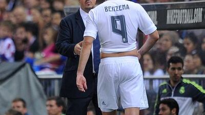 Real Madrid’s Rafa Benitez, left, says he understands why Karim Benzema is upset with being taken off. Denis Doyle / Getty Images