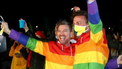 Spectators celebrate after Brisbane was named host of the 2032 Olympics.