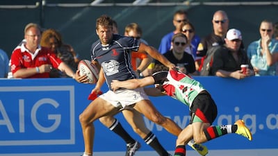 ebel Ali Dragons, in blue, were able to run past Abu Dhabi Harlequins, in green and red, right to the Dubai Rugby Sevens Gulf Men's League title at The Sevens, Dubai, on Saturday. Jake Badger for The National