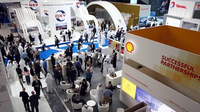 Visitors walk through the exhibitions at Adipec. Nezar Balout / AFP
