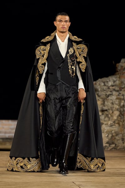 Capes and tall boots define the Sicilian man in the Alta Sartoria 2026 show. Photo: Dolce & Gabbana