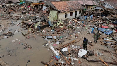 Soldiers inspect the damage in Sumur. AP Photo
