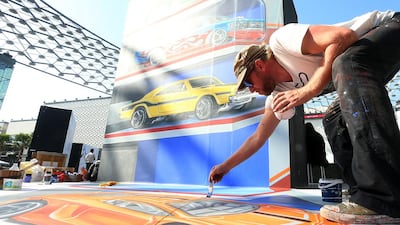 Artist Leon Keer, from the Netherlands, gives the final touch at the Dubai 3D Art Festival at the Dubai City Walk in Dubai. Satish Kumar / The National