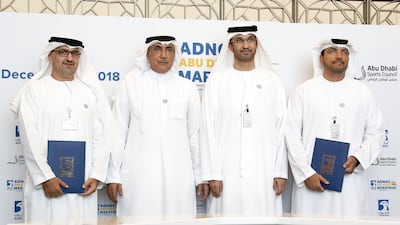 Major General Mohammed Khalfan Al Romaithi, second left, has lodged his candidacy for the AFC presidency. Pawan Singh / The National