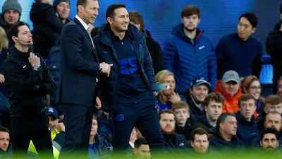 Everton's caretaker manager Duncan Ferguson and Chelsea's manager Frank Lampard shake hands after the match. AFP