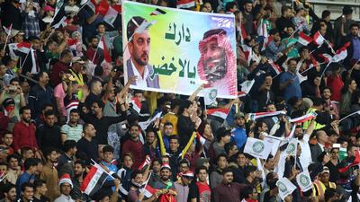 Iraqi football fans cheer for their team ahead of the international friendly match between Iraq and Saudi Arabia at the Basra Sports city stadium. Haidar Mohammed Ali / AFP