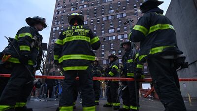 Fire crews outside the building. AFP