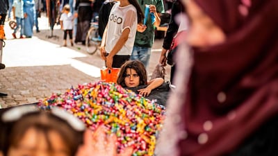 Piles of candy at the main market of the Kurdish-majority city of Qamishli in Syria's northeastern Hasakeh province on May 19, 2020, ahead of Eid. Delil Souleiman / AFP