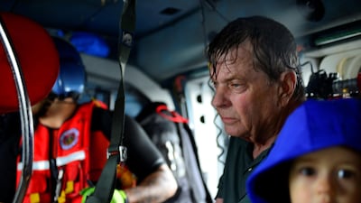 Evacuees are airlifted to safety in a US Coast Guard helicopter after flooding inundated neighborhoods in Houston on August 27, 2017. US Coast Guard / Petty Officer 3rd Class Johanna Strickland / Handout via Reuters