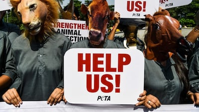 Indian volunteers for animal rights group People for the Ethical Treatment of Animal wear masks of various animals during a protest in New Delhi. Chandan Khanna/AFP