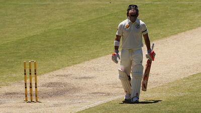 David Warner looks to the sky in tribute to Phillip Hughes during the first Test against India. Michael Dodge / Getty Images