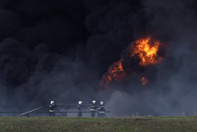 Firefighters battle a fire at Lysychansk oil refinery in the Luhansk region of eastern Ukraine. Reuters