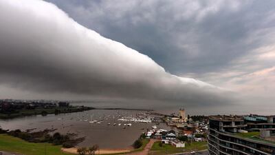 A coastal roll cloud passes over the Puertito del Buceo marina during a storm in Montevideo. AFP
