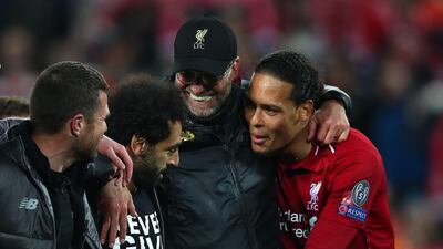 Liverpool Jurgen Klopp with Mohamed Salah and Virgil van Dijk after the match. Getty
