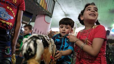 Syrian children play in an underground playground built to protect them from shelling in the rebel-held town of Erbin, east of the capital Damascus.