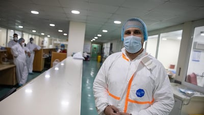 Nurse Abdullah Khattabi poses for a portrait in the Intensive Care Unit at the Rafic Hariri University Hospital in southern Beirut, which will be the first in Lebanon to start vaccinating its staff after the first shipment of the Pfizer-BioNTech vaccine arrives on February 13, 2021. Tom Nicholson / The National
