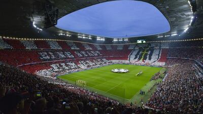Players arrive on the pitch prior to the Champions League semi-final second leg on Tuesday between Bayern Munich and Barcelona. STR / AFP