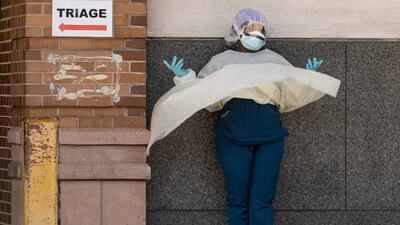 A medical worker takes a break outside a Brooklyn hospital in New York City. AFP