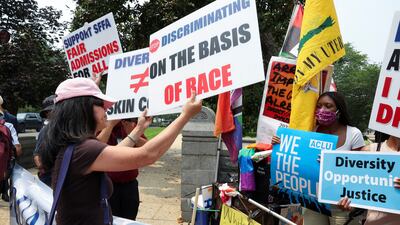 Demonstrators for and against the Supreme Court's ruling on affirmative action confront each other in Washington. Reuters