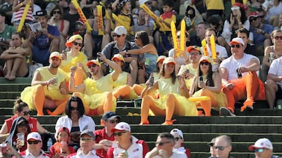 Fans cheer from the stands on Day 2 of the Dubai Rugby Sevens at The Sevens. Chris Whiteoak / The National