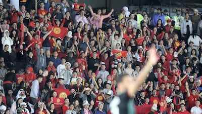 Kyrgyzstan fans cheer during the match at Zayed Sports City in Abu Dhabi.