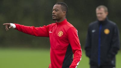 Patrice Evra is shown at a Manchester United training session on October 22, 2013. Jon Super / AP