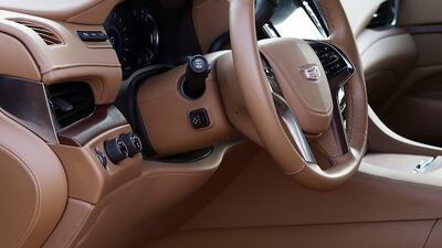 The New Cadillac Escalade’s attractive blend of high-quality leather and woodgrain surfaces, making for a suitably premium ambience ( Satish Kumar / The National