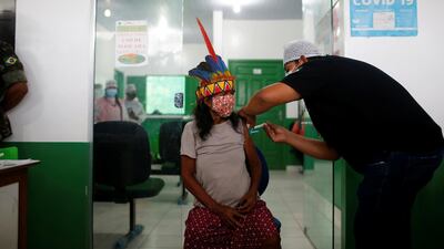A member of the Ticuna tribe receives the Sinovac Covid-19 vaccine in Tabatinga, Amazonas state, Brazil. Reuters