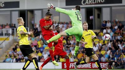 Liverpool’s Roberto Firmino scores their second goal. Darren Staples / Reuters