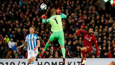 Liverpool's Mohamed Salah scores their third goal. Reuters