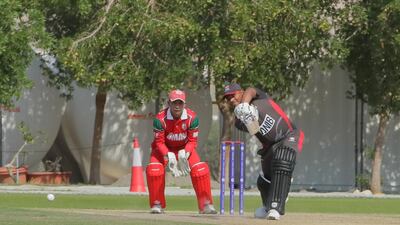 UAE, in grey, lost to Oman by five wickets in their World Cup League Two match on Sunday. Courtesy Oman Cricket