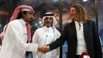 Bruno Metsu, right, shakes hands with Fahad Al Kuwari, left, team manager of Qatar's Football national team, while Sheikh Hamad bin Khalifa bin Ahmed al Thani, president of Qatar's Football Federation, centre, looks on after Metsu signed a two-year contract as a coach for Qatar's national football team in Doha on Sept 25 2008.