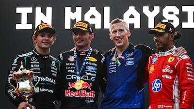 Race winner Max Verstappen, second left, alongside second placed Kimi Antonelli, left, and Lewis Hamilton ,right, who was third. Getty Images