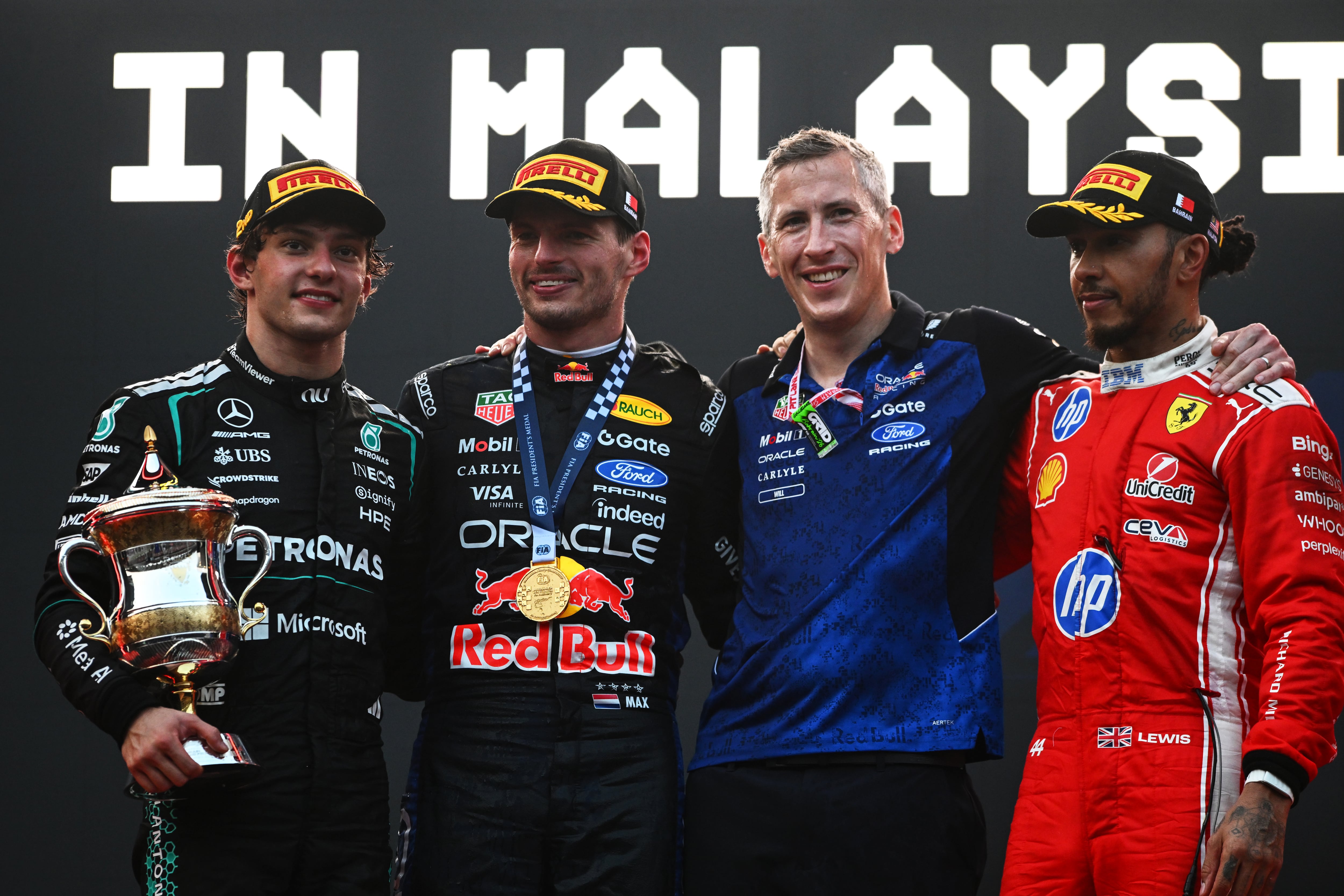 Race winner Max Verstappen, second left, alongside second placed Kimi Antonelli, left, and Lewis Hamilton ,right, who was third. Getty Images