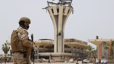 A Saudi soldier stands guard at Aden International Airport on July 24, 2015. The airport was badly damaged in a Houthi missile attack in December 2020. Faisal Al Nasser / Reuters