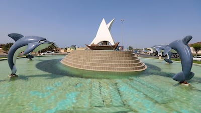 Leaping dolphins and a model of a traditional dhow distinguish this roundabout in Dibba.