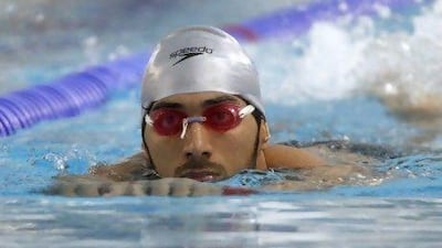 Mubarak Salem, the Emirati swimmer who will compete at the Olympics tomorrow, sings Arabic songs in his head while training. Jeff Topping / The National