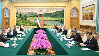 Khaldoon Al Mubarak and Wang Yi are leading the delegations of the UAE and China. Photo: Wam