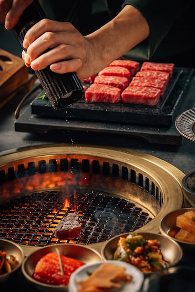 The way Hanu's team cook and prepare your steak at the table is one of the restaurant's standout features. Photo: Hanu