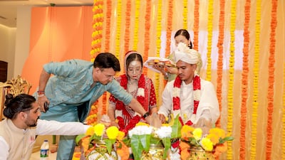The wedding rituals usually take about three to four hours with the priest explaining the rituals. Photo: Suraj Negi