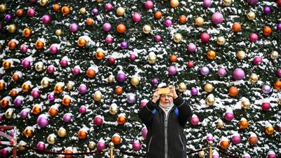 Time for a festive selfie in front of the Christmas and New Year decorations in central Moscow. AFP