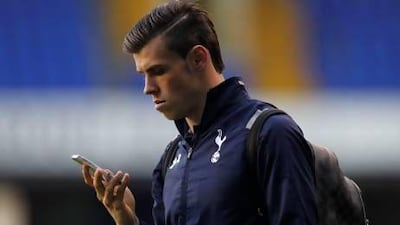 Tottenham Hotspur's Gareth Bale is awaiting a formal confirmation for a move to the big-spending Real Madrid. Ian Kington / AFP