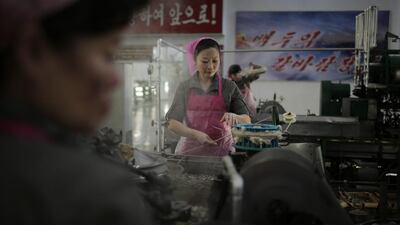 A North Korean worker boils silkworm cocoons at the Kim Jong-suk silk mill in Pyongyang, North Korea. Wong Maye-E/AP Photo