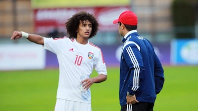 Omar Abdulrahman, left, talks things over with the United Arab Emirates' coach Mahdi Ali. DANIEL RAUNIG / AFP