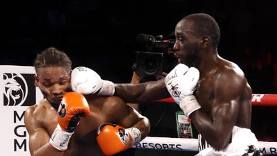 WBO champion Terence Crawford punches Shawn Porter. AFP