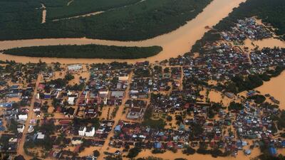 Houses and plantations submerged in floodwaters in Pengkalan Chepa, near Kota Bharu, on December 27, 2014. Mohd Rasfan/AFP