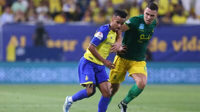 Nassr midfielder Abdulrahman Ghareeb vies for the ball with Khaleej defender Pedro Amaral.